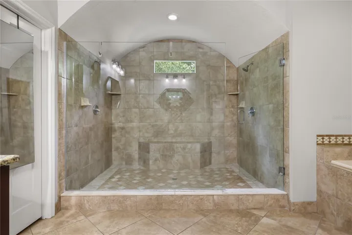 DOUBLE SHOWER WITH DUAL SHOWER HEADS AND BUILT IN BENCH