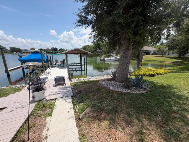 Boat dock with covered lift