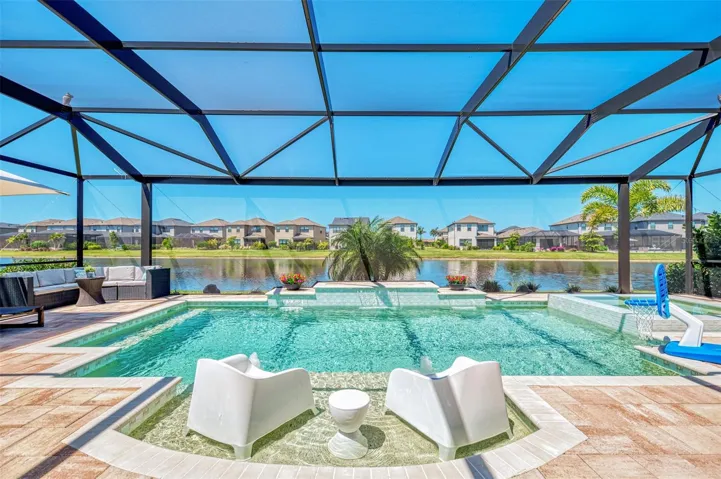 Luxury living at its finest - gorgeous heated saltwater pool with spa and sunshelf