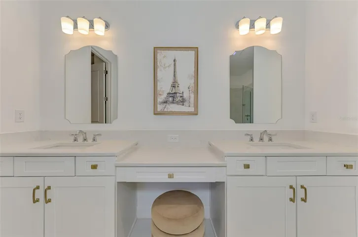 Primary bathroom with dual vanities