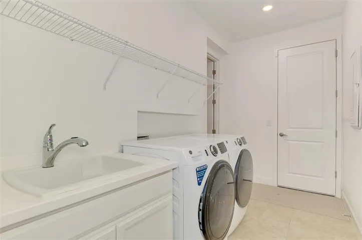Laundry room with access to the Primary Bedroom