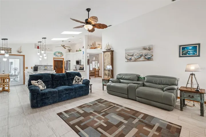 Open flow between living room and kitchen, built for everyday living and entertaining