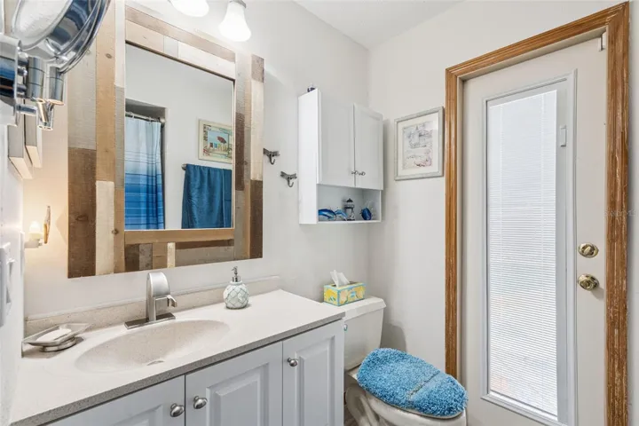 Guest bathroom with access to pool area for easy use while enjoying the pool and large lanai