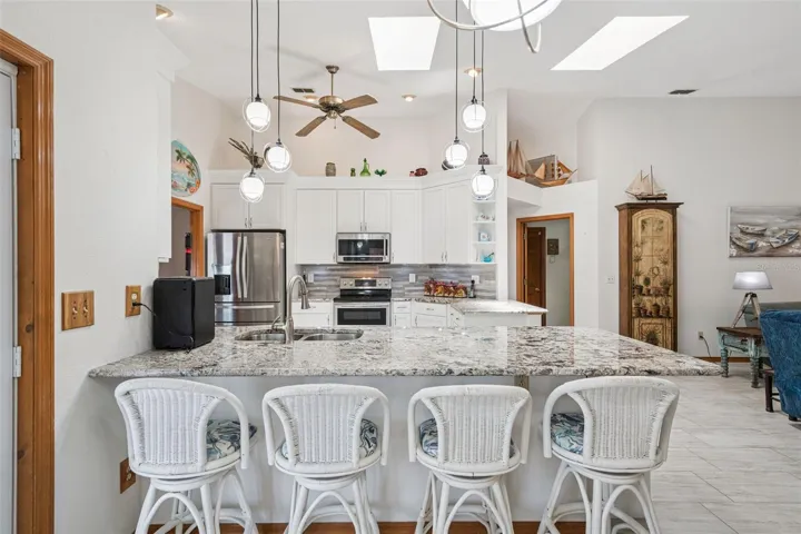 Skylights bring in natural light, enhancing the open and airy feel