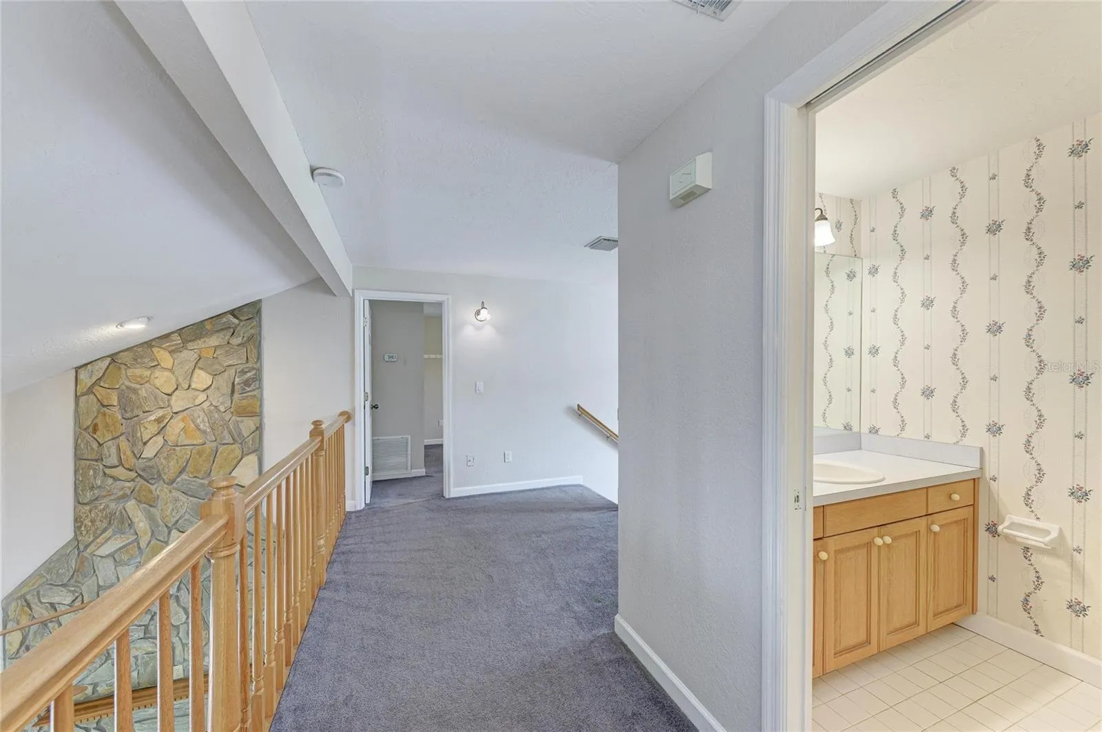 Balcony leading to bedroom #2 and full bathroom