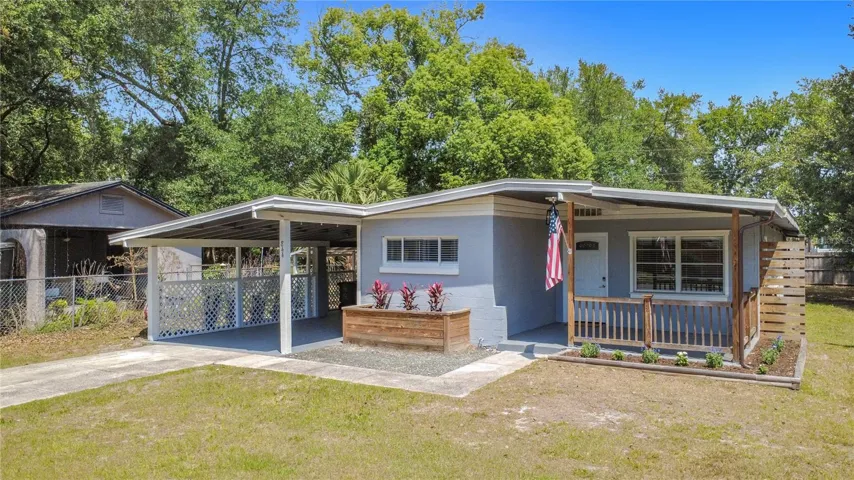 Front of Home with Front Porch and Tandem Carport