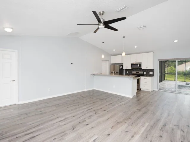 great room looking from front door to slider to pool