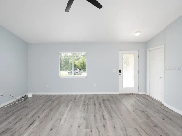 great room looking from kitchen toward front door