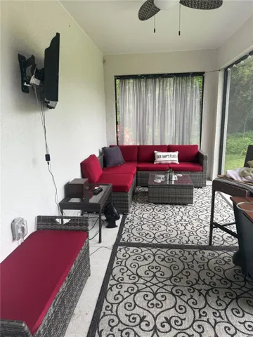 staged screeened lanai off kitchen