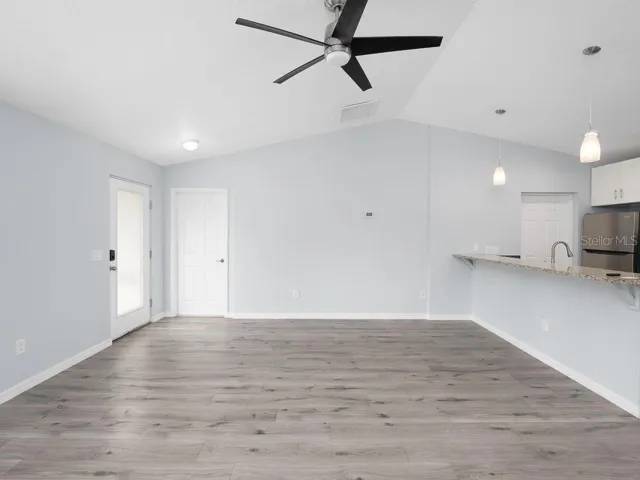great room looking from hallway to front door