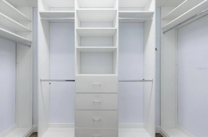 Primary bedroom walk-in closet