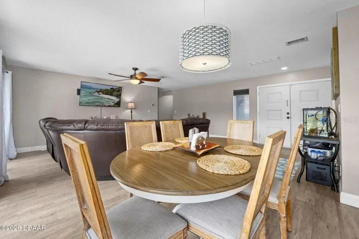 Dining Area with Living Room Beyond and Front Doors to the Right
