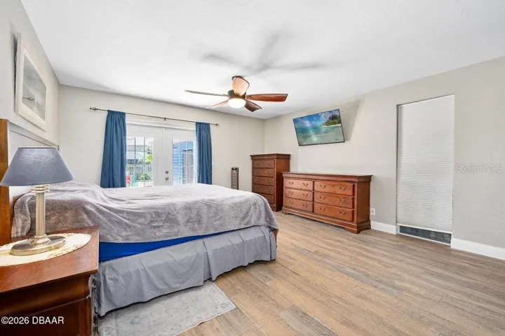 Primary Bedroom with Sliders to the Pool