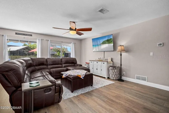 Living Room with Huge Window and Slider to Pool
