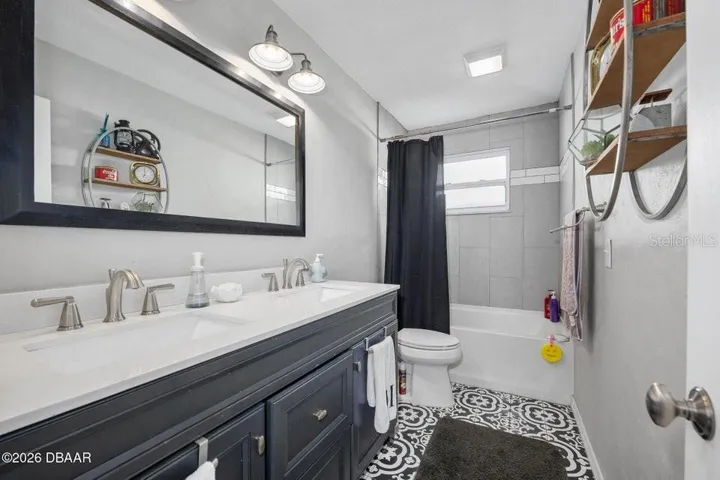 Hall Bath with Double Sinks and Tub Shower