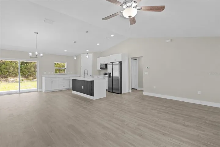 Looking at the kitchen and dining area from the living room