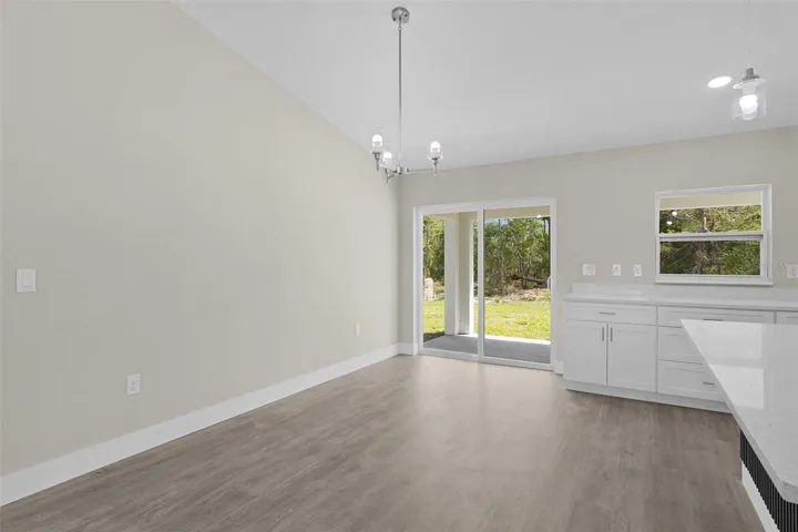 Sliding doors in the dining area lead onto the covered rear lanai