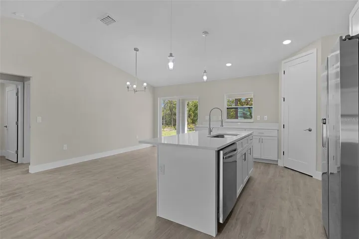Beautiful kitchen with breakfast bar island and corner pantry