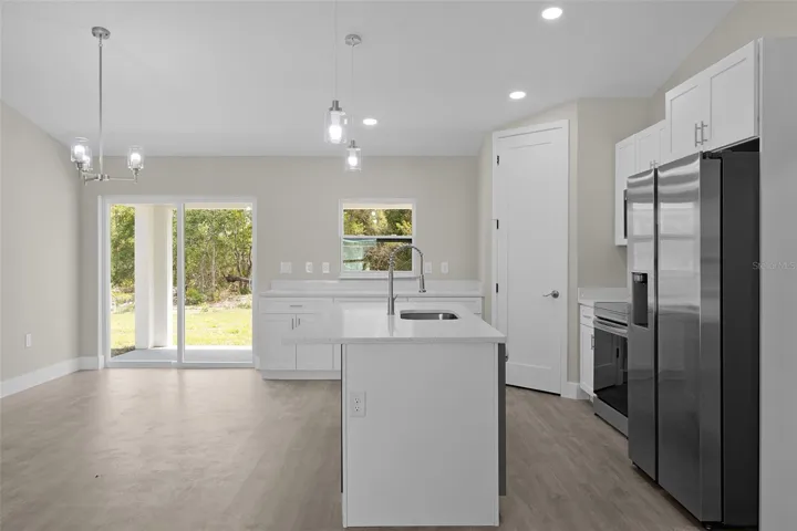 Open entertaining area with vaulted ceiling