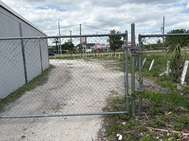 East side of building showing fence and gate
