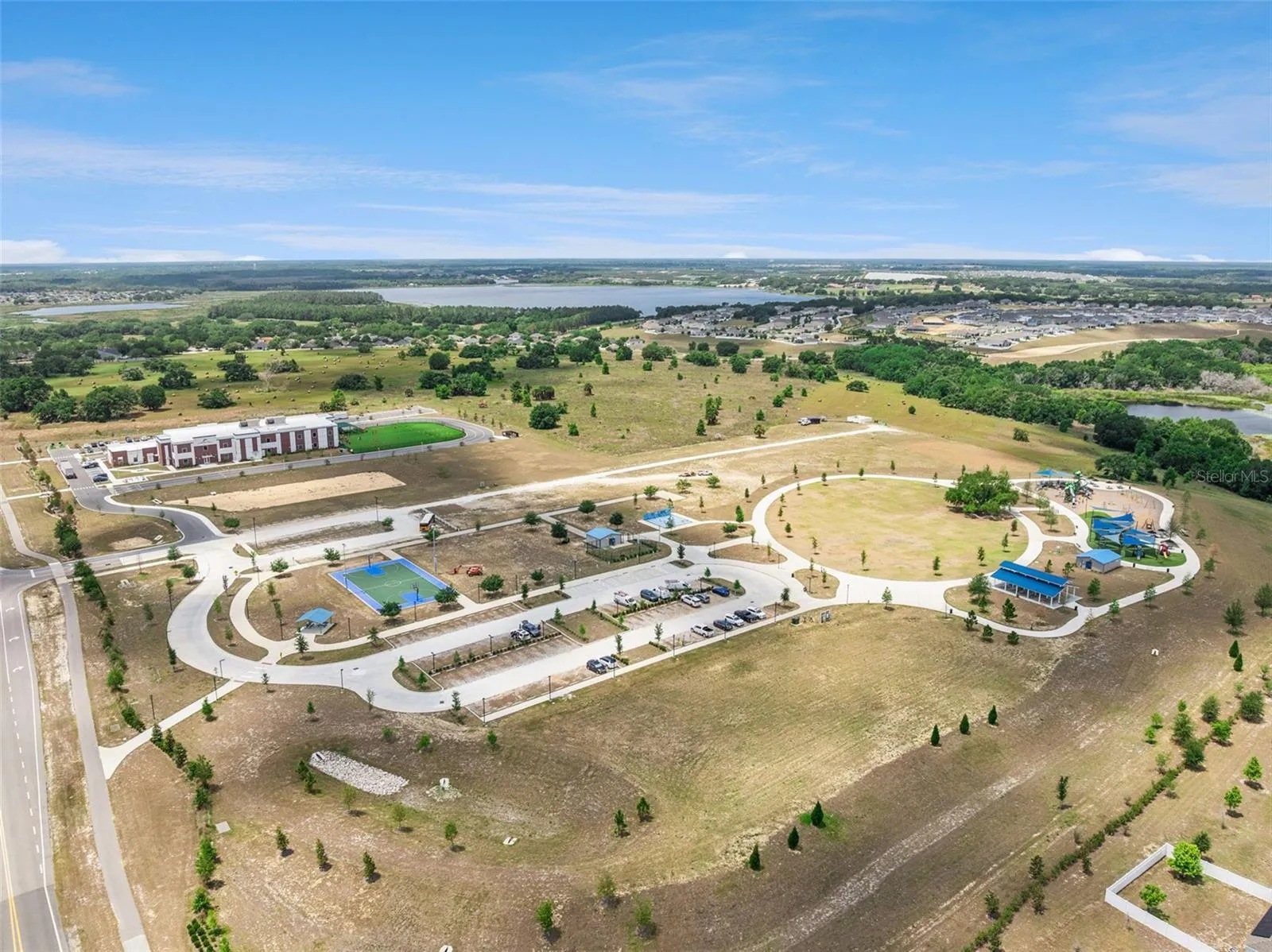 Basketball courts, playground, and school in the heart of Cherry Lake Community