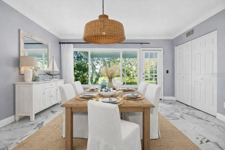 Virtually Staged Florida Room as a Dining Room