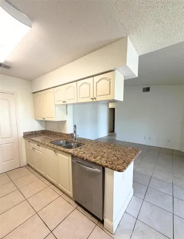 Bright cabinetry and granite countertops