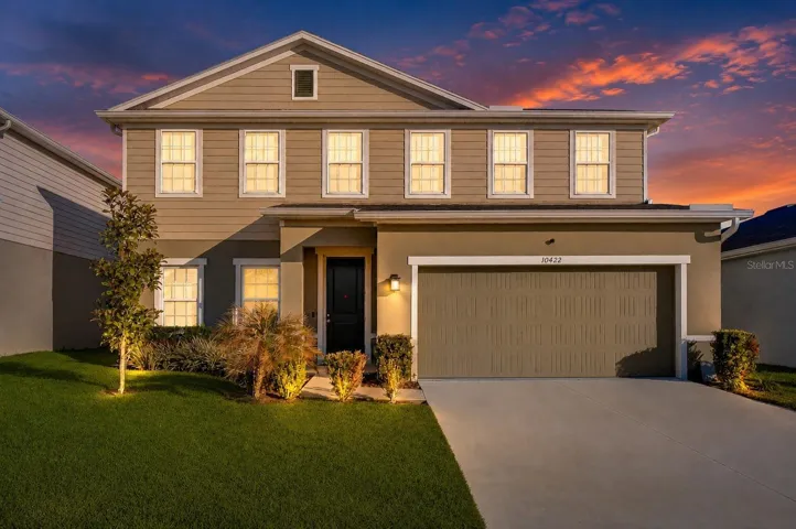 Stunning exterior at evening showcasing exceptional curb appeal.