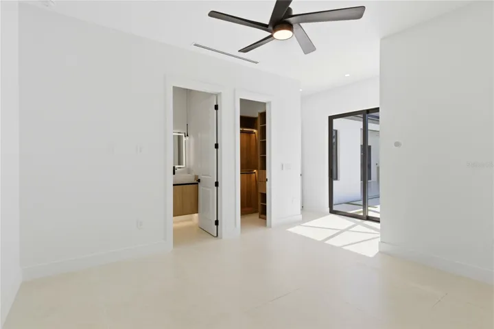 Second Primary Bedroom - Flexible layout includes an additional entry access, ideal for guest privacy or multi-generational living.