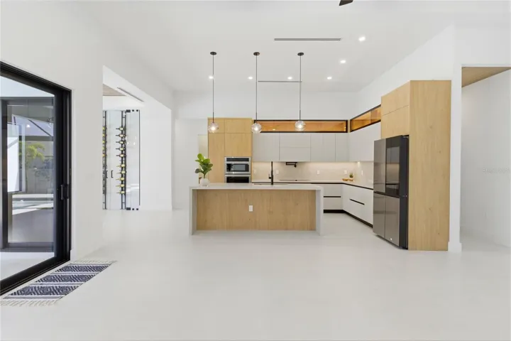 electric WALL OVEN w/ built-in WALL MICROWAVE, INDUCTION COOKTOP w/ black glass, INTEGRATED DISHWASHER