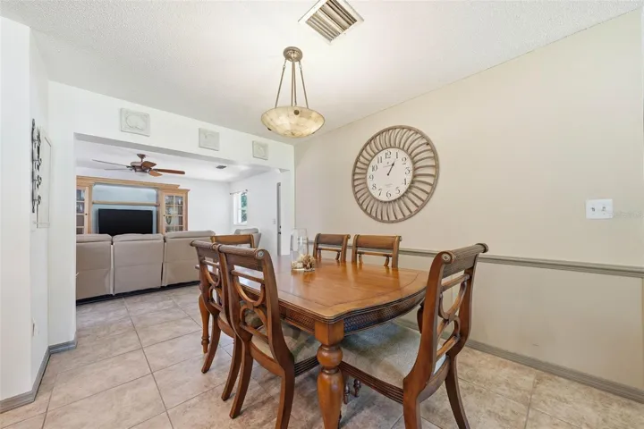 kitchen dining with the family room beyond