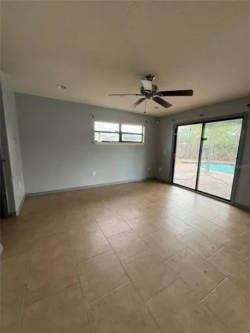 family room with sliding doors leading to the pool