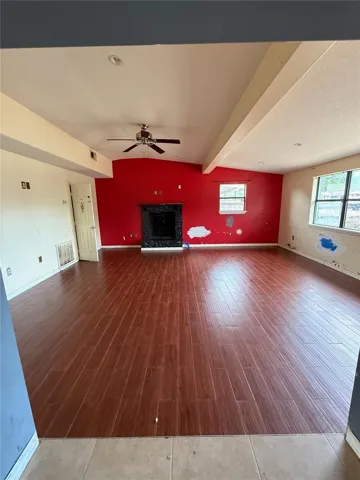 oversized family room with chimney and storage closet