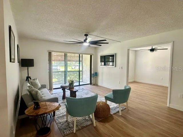 Living room w screen patio in background