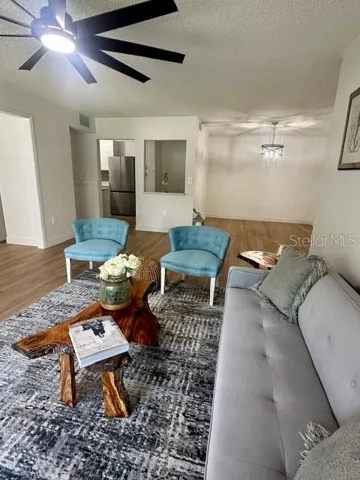 Living room with Kitchen /Dining in background
