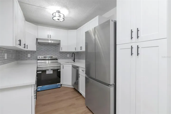 Stylish Kitchen with Granite Countertops & Subway Backsplash