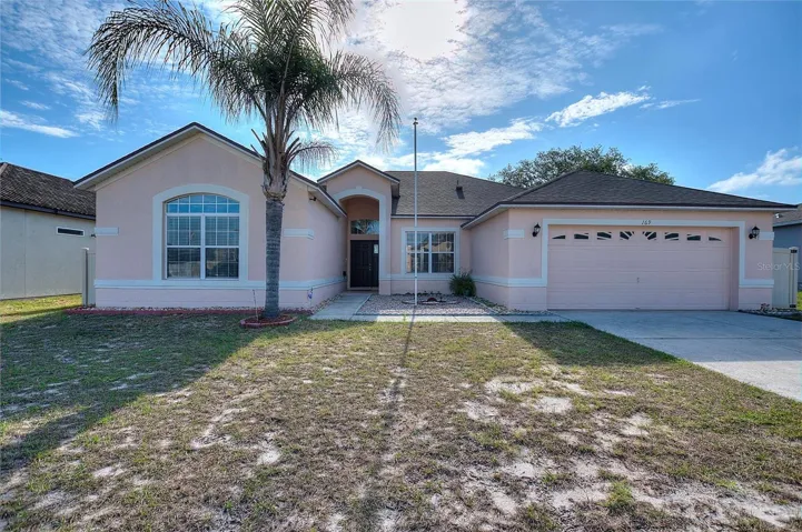 Inviting front elevation featuring a two-car garage and attractive architectural details.