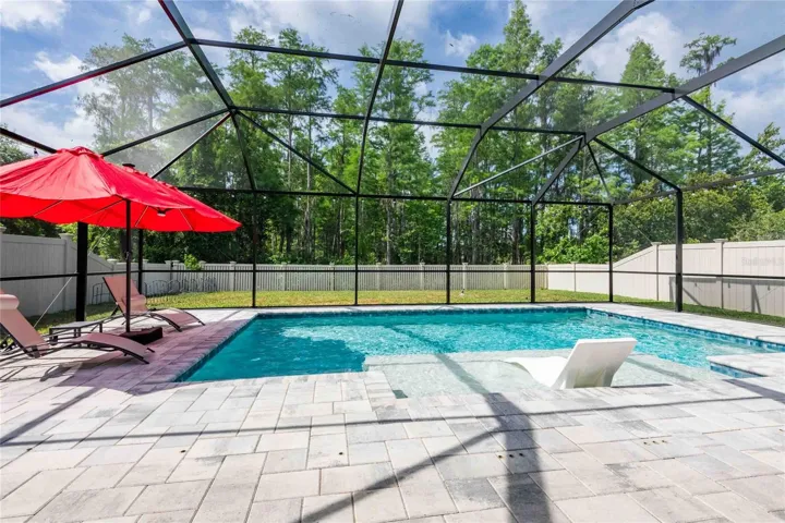 Enjoy the conservation view while relaxing at your pool!