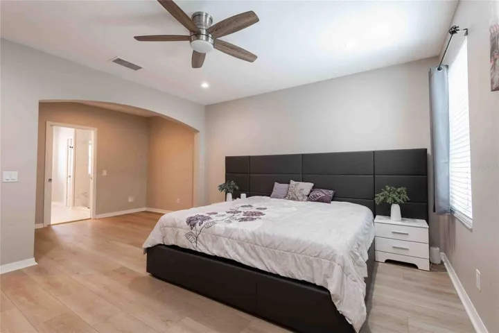 The space off the bedroom can be used as a home office, relaxation area, or an exercise area.