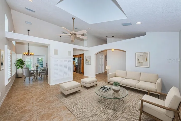 Living room with vaulted ceilings - virtually staged