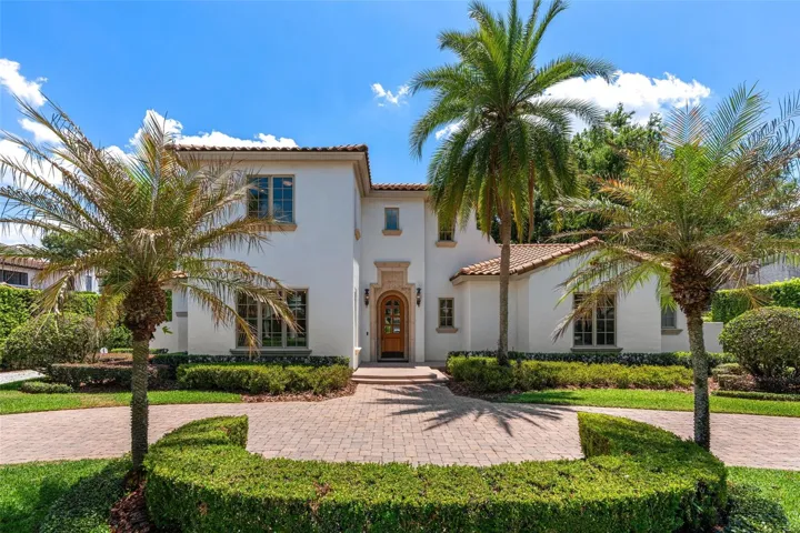 Nestled on a quiet, brick paved street, this house is on  a .34 acre lot with mature landscaping offering privacy