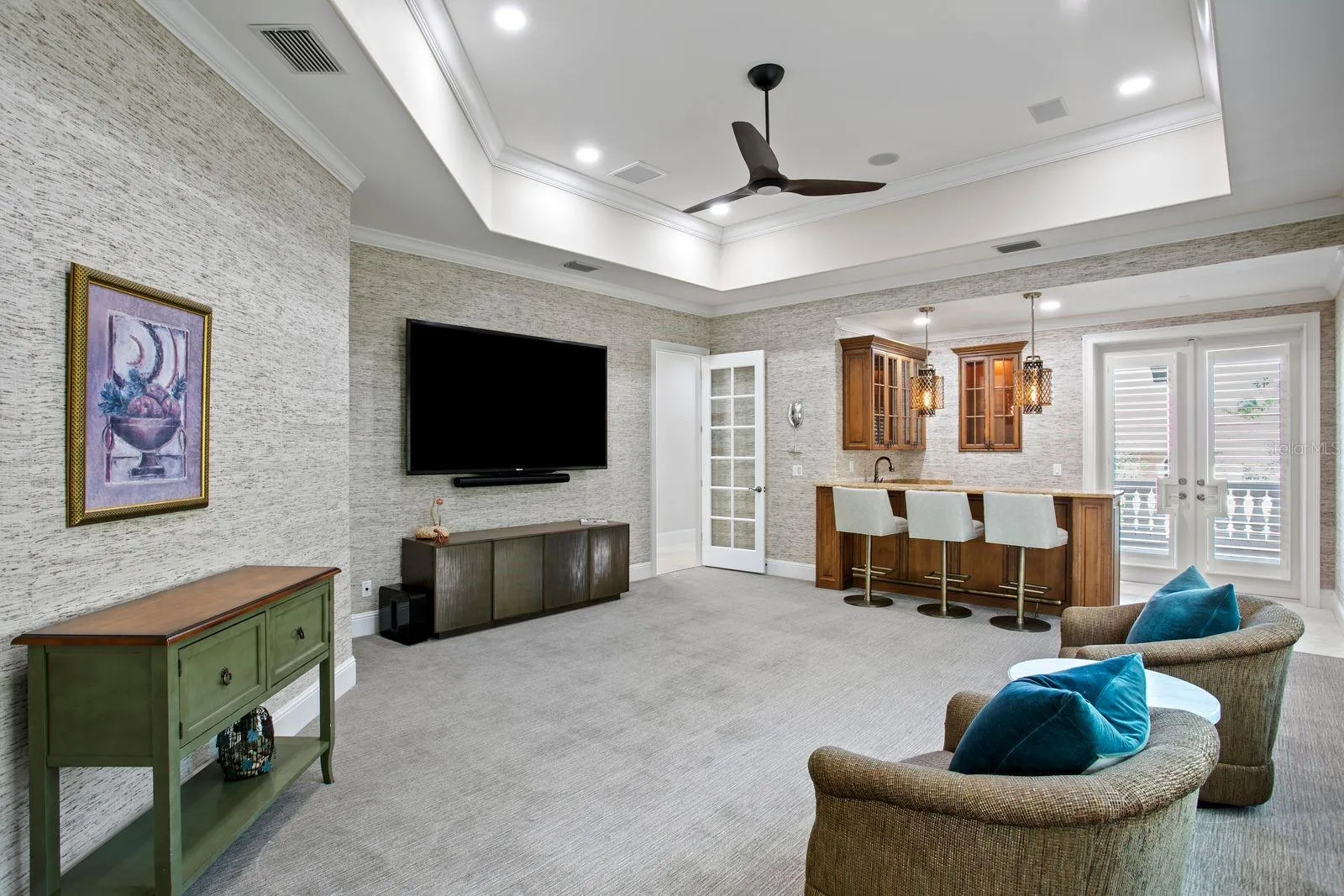 Elegant social lounge featuring a refinded bar.