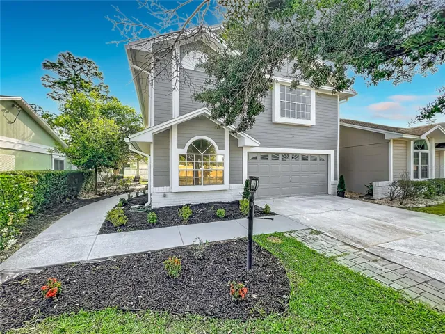 Beautiful curb appeal with fresh landscaping and modern exterior
