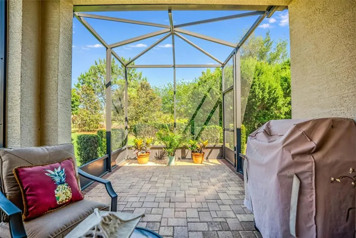 Outside lanai with paver and extended screened area.