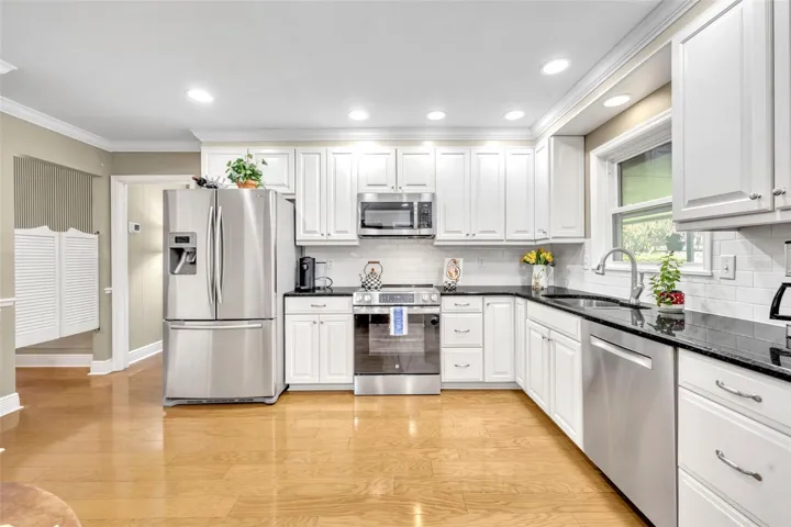 Expansive Kitchen with plenty of granite counter workspace