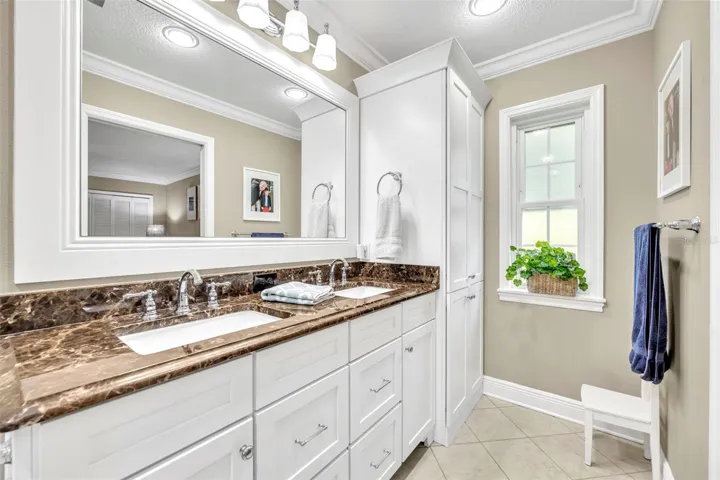 Primary Bath features double vanity with granite counters