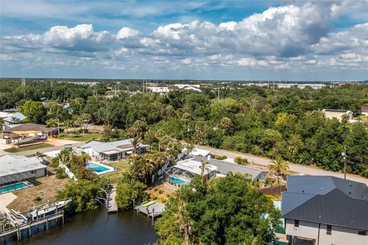 Aerial view of canal and house.