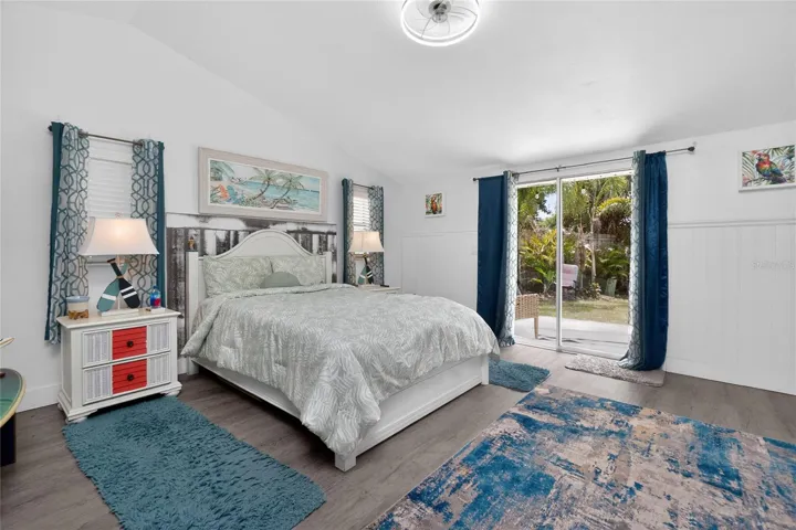 Primary bedroom overlooking back yard and canal.