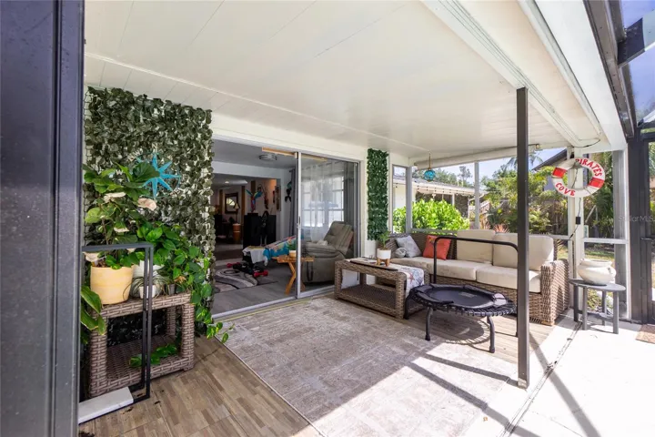 Screened porch by pool.