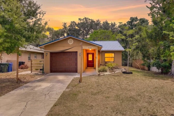 Front of home with a Beautiful new garage door and new long lasting metal roof